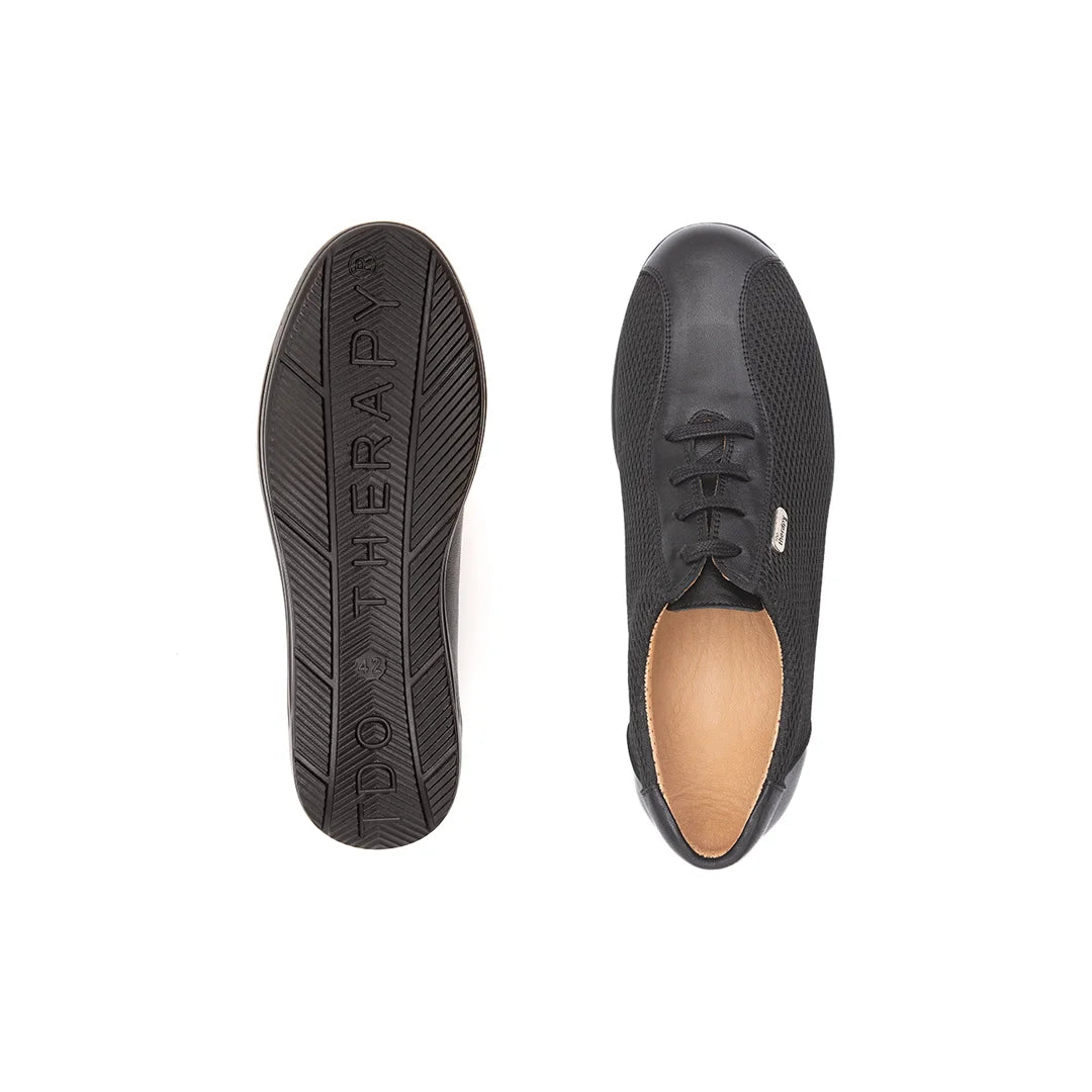 Close-up of the TDO Therapy rocker bottom sole on black men's orthopedic diabetic rocker shoes showcasing shock-absorbing features.
